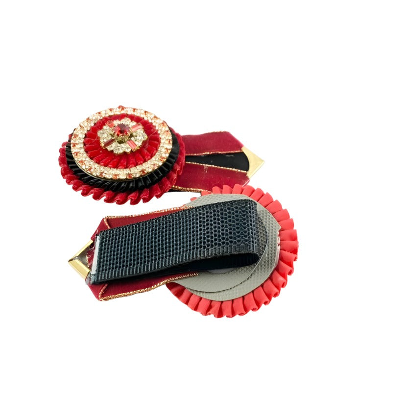 Vivid crimson red rosettes designed to stand out with their vibrant hue and customizable features, perfect for enhancing equestrian gear