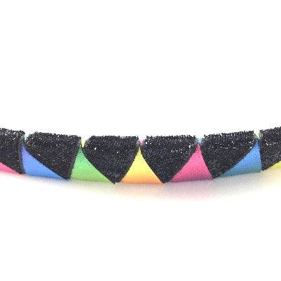 Close-up of stylish ribbon browband in rainbow colors for horse tack