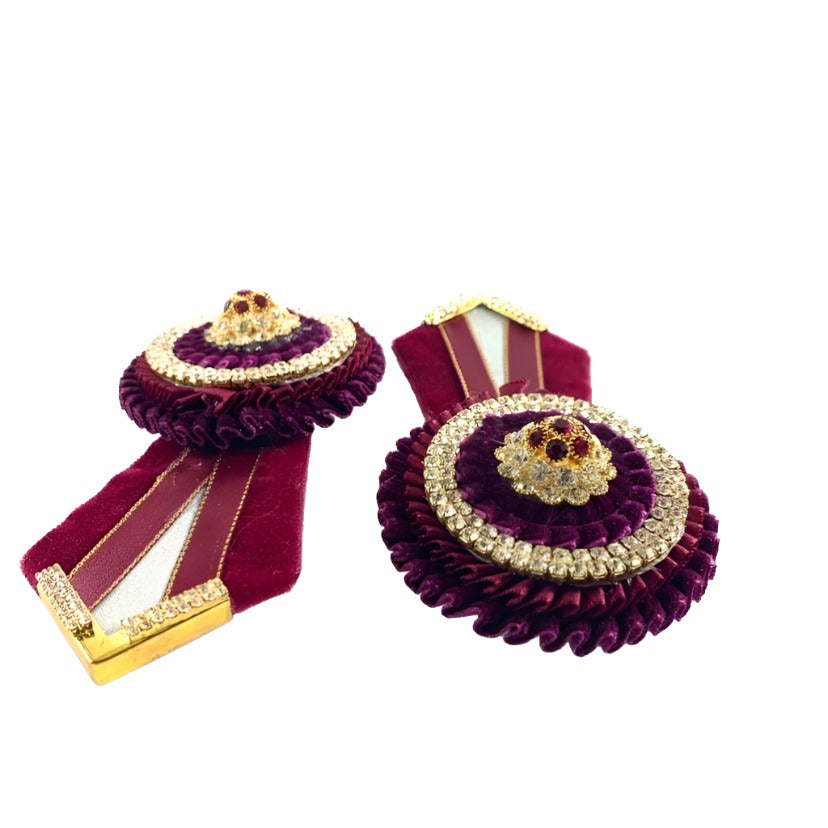 Burgundy rosette embellishments for horse tack, highlighting their decorative appeal and versatility in various equestrian disciplines.