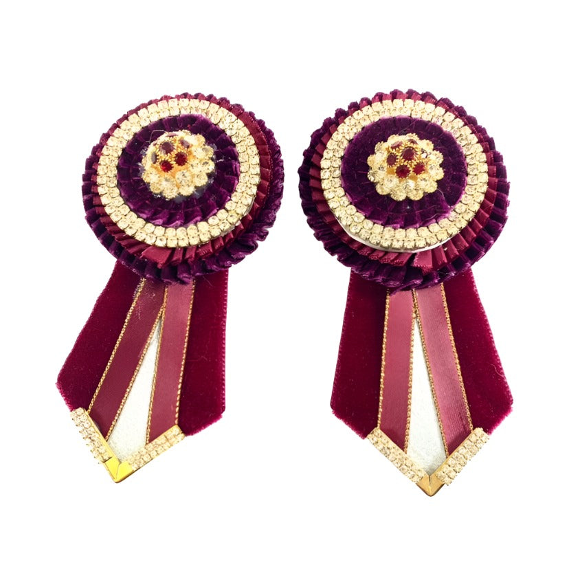 Rich burgundy rosette accents, showcasing their deep color and intricate stitching, perfect for adding sophistication to horse bridles